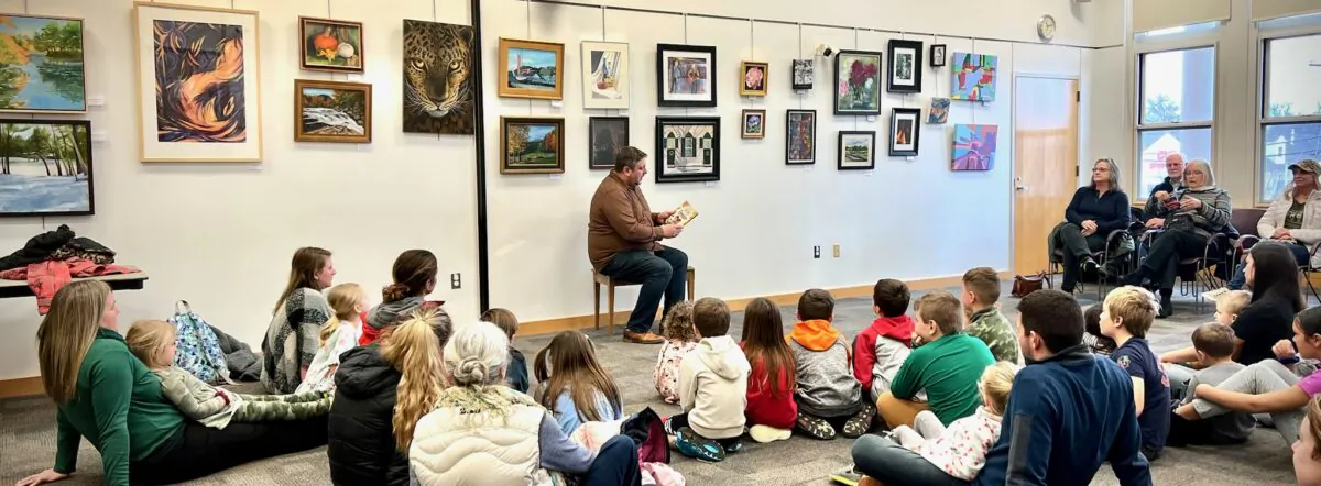 Massachusetts Pastor Kendall Lankford reads to a crowd at the Chelmsford Public Library for the first "pastor story hour" held in New England. (Courtesy of The Shepherd's Church, Chelmsford, Ma.)