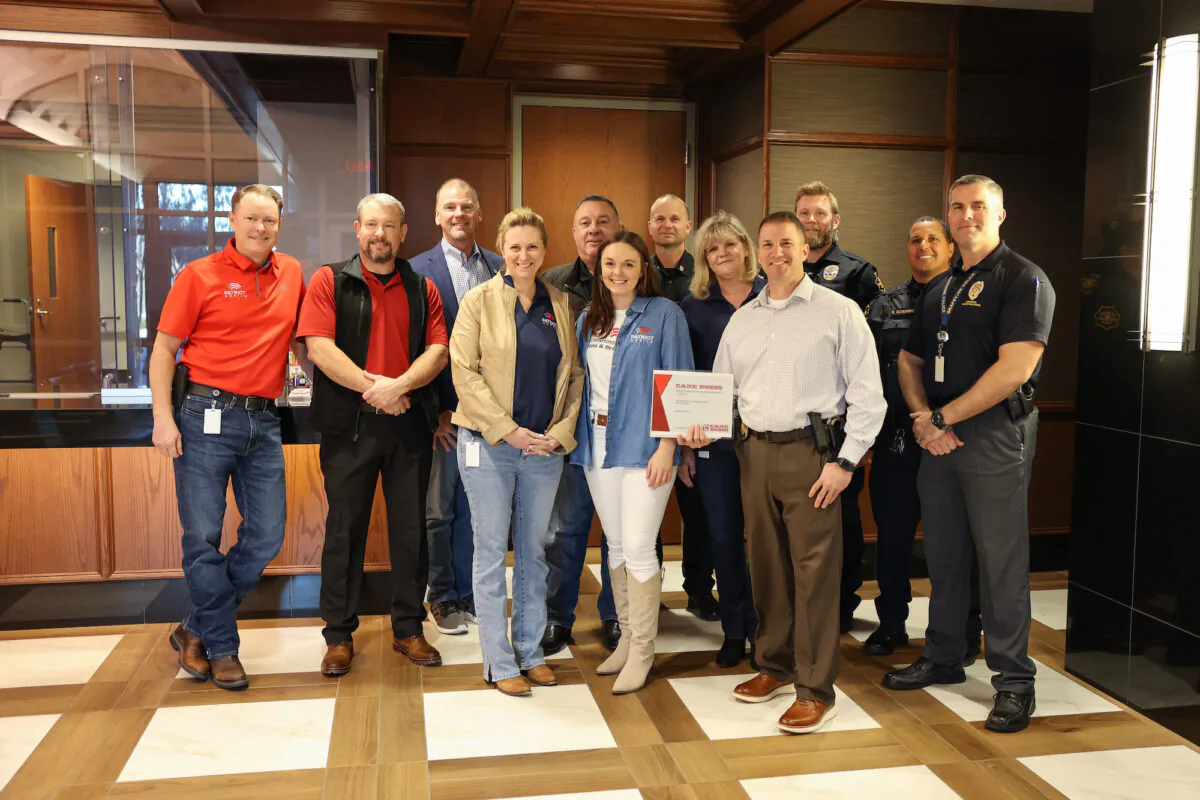 Patriot Mobile team members present a $1,500 restaurant gift certificate to the Grapevine Police Department in Grapevine, Texas, on Jan. 12, 2023. (Courtesy of Patriot Mobile)
