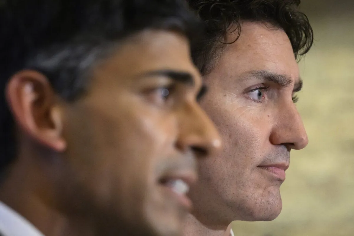 Canadian Prime Minister Justin Trudeau, right, and British Prime Minister Rishi Sunak hold a press conference at the G20 summit in Nusa Dua, Bali, Indonesia Nov. 16, 2022. (The Canadian Press/Leon Neal)
