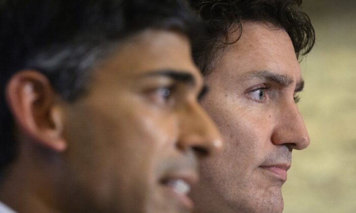 Canadian Prime Minister Justin Trudeau, right, and British Prime Minister Rishi Sunak hold a press conference at the G20 summit in Nusa Dua, Bali, Indonesia Nov. 16, 2022. (The Canadian Press/Leon Neal)

