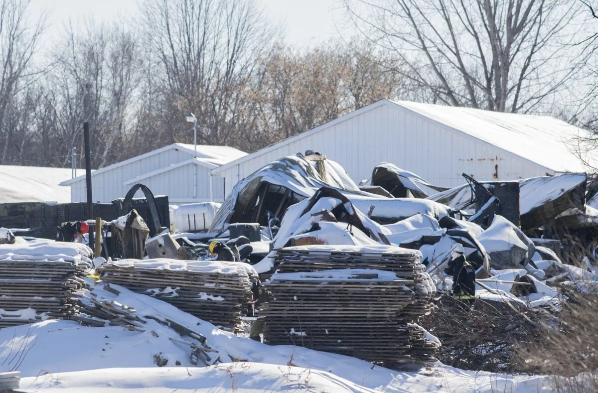 Technicians survey the scene at a propane distribution company in St-Roch-de-l'Achigan, Que., Jan. 15, 2023. (The Canadian Press/Graham Hughes)
