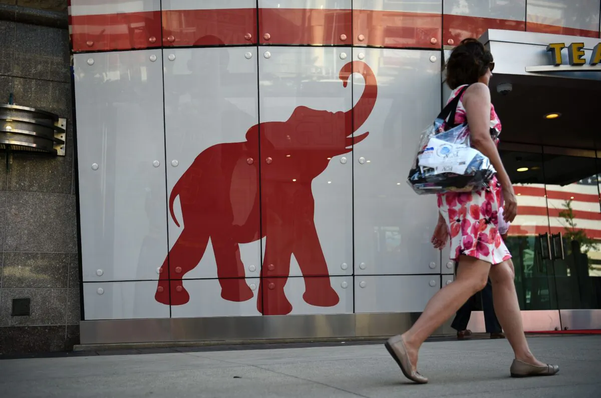 A woman walks past the elephant logo of the Ohio Republican Party on the first day of the Republican National Convention in Cleveland, Ohio, on July 18, 2016. (Dominick Reuter/AFP via Getty Images)