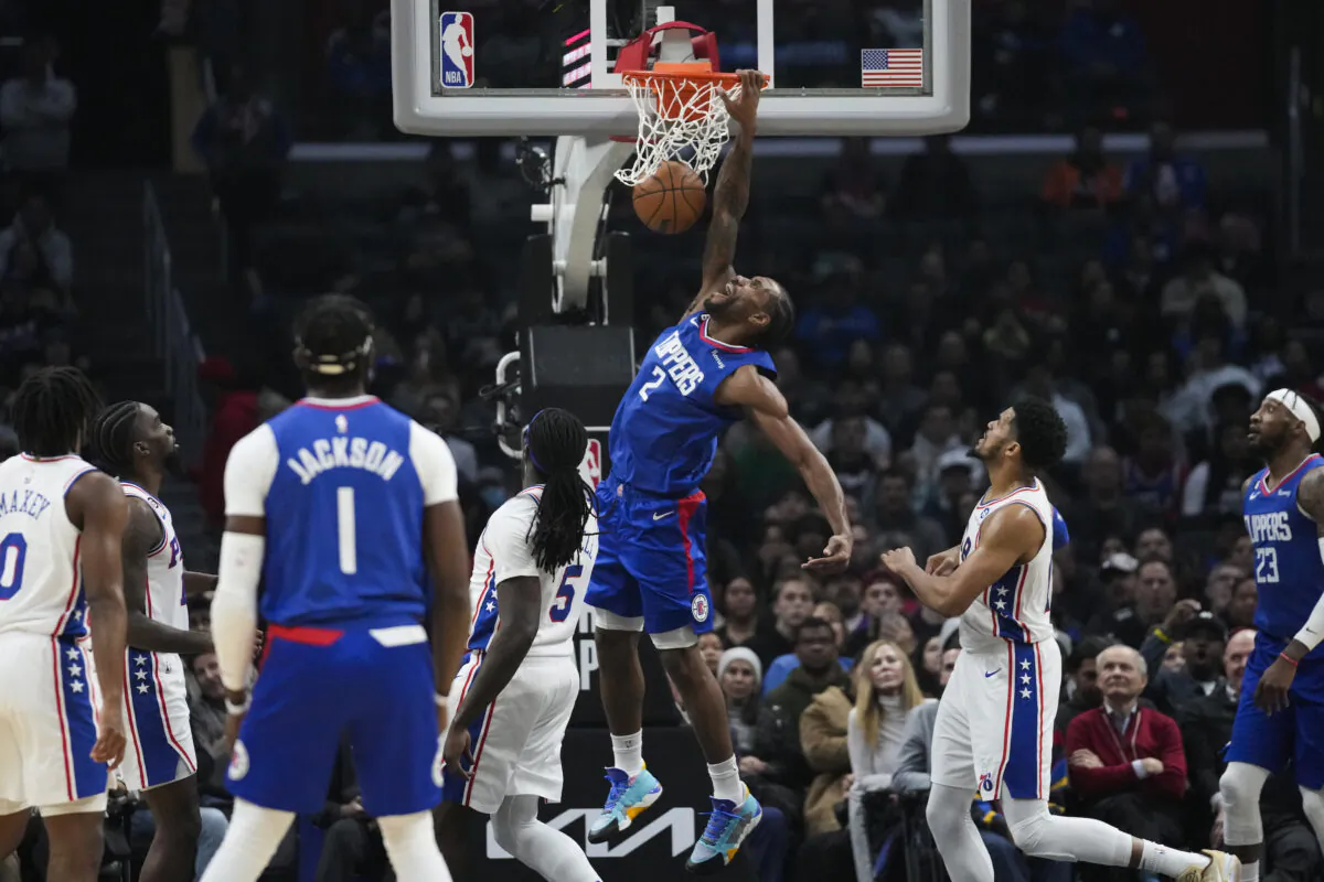 Los Angeles Clippers forward Kawhi Leonard (2) dunks during the first half of an NBA basketball game against the Philadelphia 76ers in Los Angeles on Jan. 17, 2023. (Ashley Landis/AP Photo)