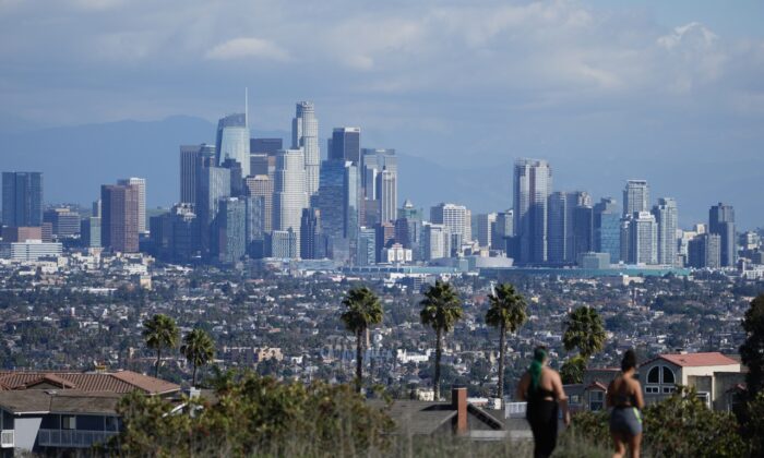 Storm clouds blanket the Los Angeles skyline as seen from Kenneth Hahn State Recreation Area following a rainstorm in Los Angeles, Calif., on Jan. 17, 2023. (AP Photo/Damian Dovarganes)