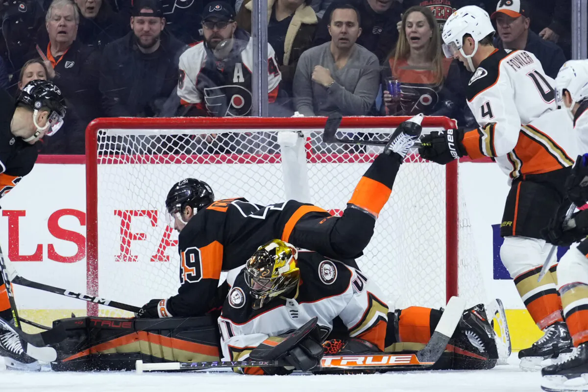 Philadelphia Flyers' Noah Cates (49) collides with Anaheim Ducks' Anthony Stolarz (41) during the first period of an NHL hockey game in Philadelphia on  Jan. 17, 2023. (Matt Slocum/AP Photo)
