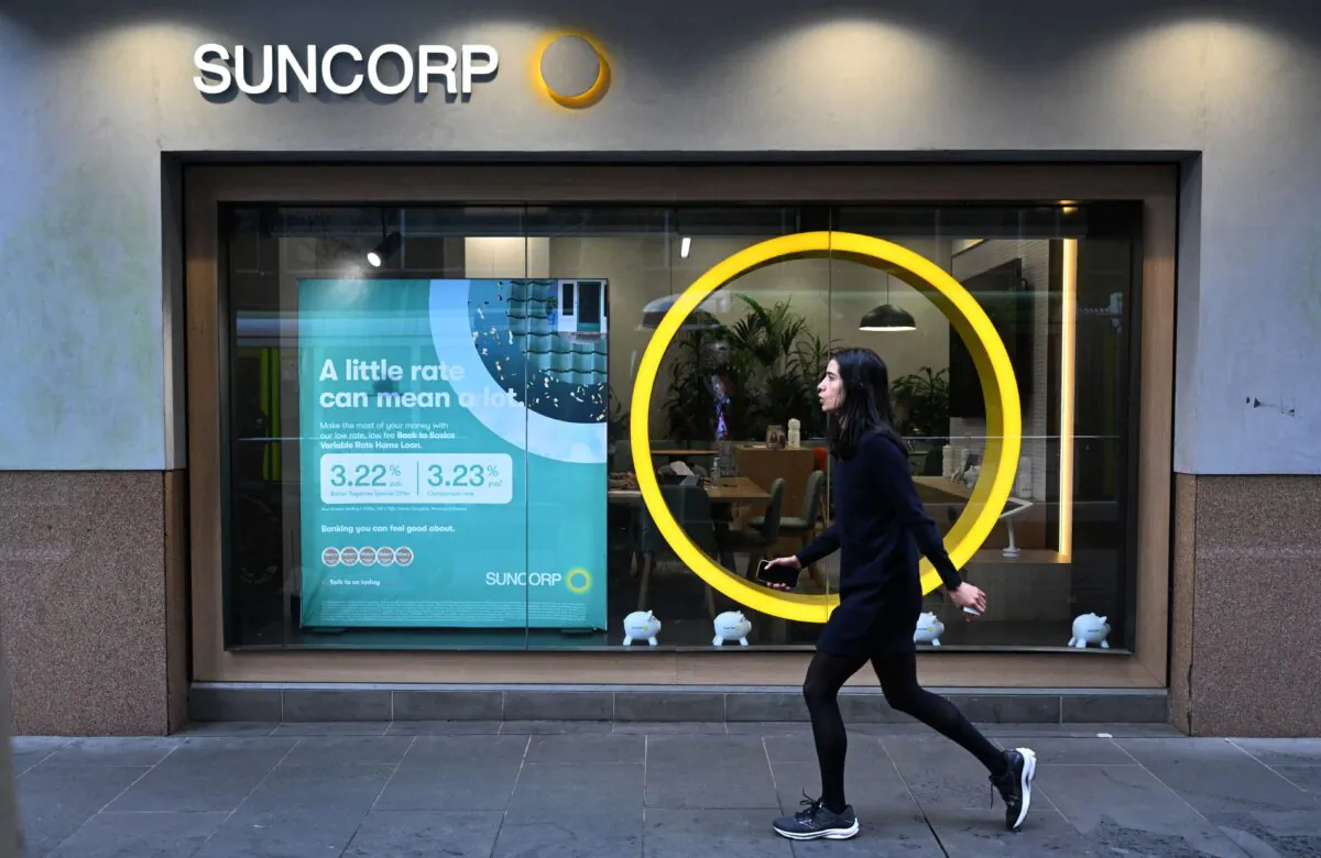 A pedestrian walks past a Suncorp Bank branch in Melbourne, Australia, on July 18, 2022. (William West/AFP via Getty Images)