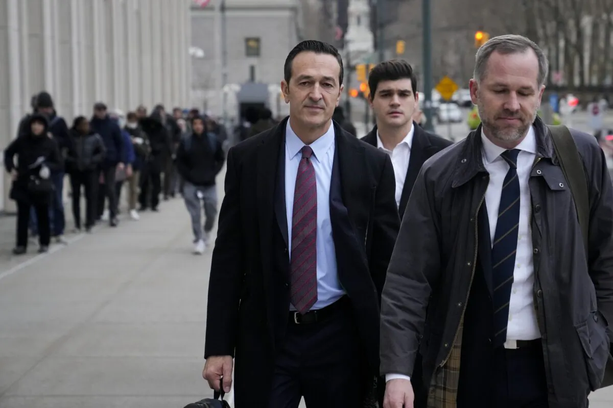 Former 21st Century Fox executive Hernan Lopez (L) arrives to Federal court in Brooklyn, New York, on Jan. 17, 2023. (John Minchillo/AP Photo)