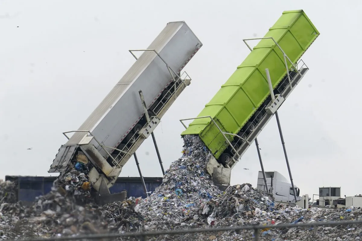 Garbage is offloaded into a landfill in Michigan on July 28, 2022. (Paul Sancya/AP Photo)