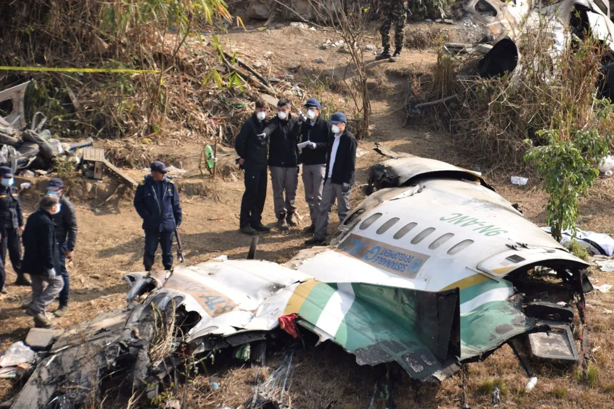 A French investigating team investigates the wreckage of a Yeti Airlines operated aircraft in Pokhara, Nepal, on Jan. 18, 2023. (Krishna Mani Baral/Reuters)