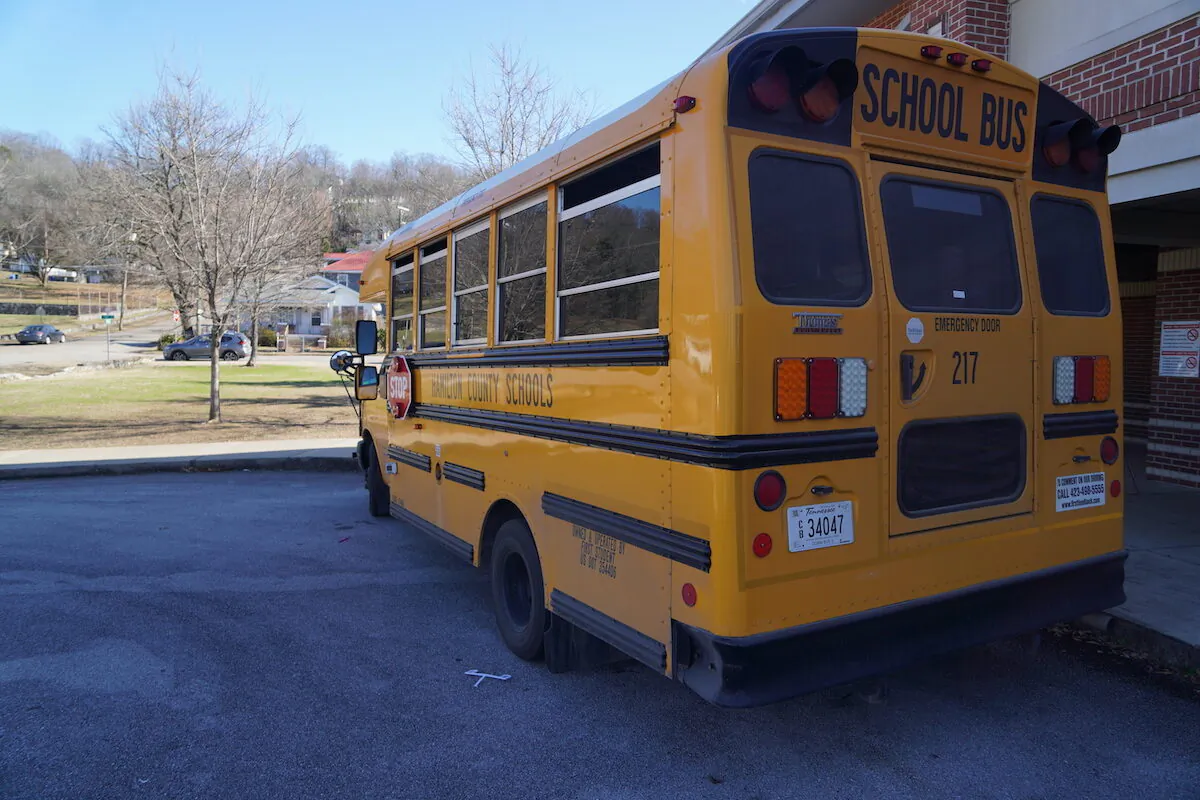 A school bus waits to pick up children outside an elementary school in Chattanooga, Tenn. on Jan. 19, 2023. (Jackson Elliott/The Epoch Times)