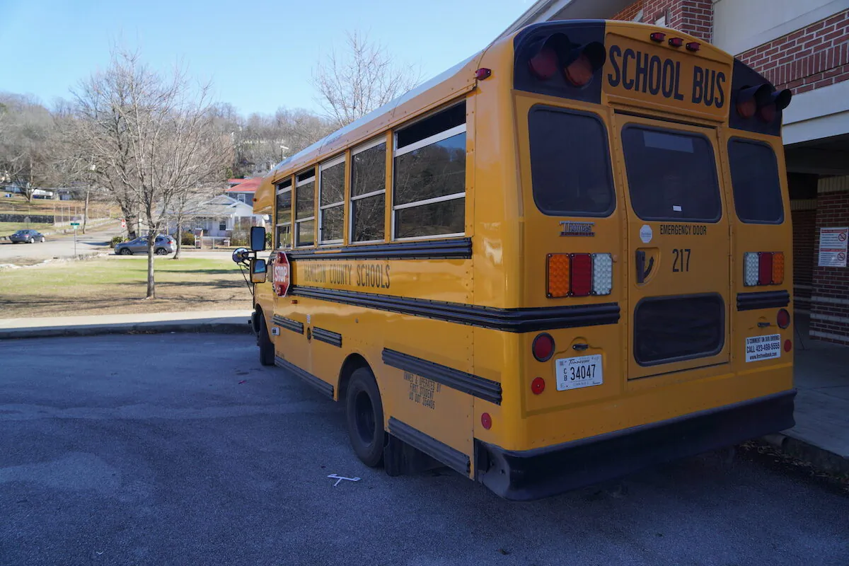 A school bus waits to pick up children outside a school in Chattanooga, Tenn. on Jan. 19, 2023. (Jackson Elliott/The Epoch Times)