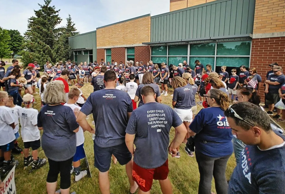 Ottawa Impact activists pause to pray before going out to campaign on Aug. 1, 2022 in Allendale Twp., Mich. (Courtesy of Ottawa Impact)