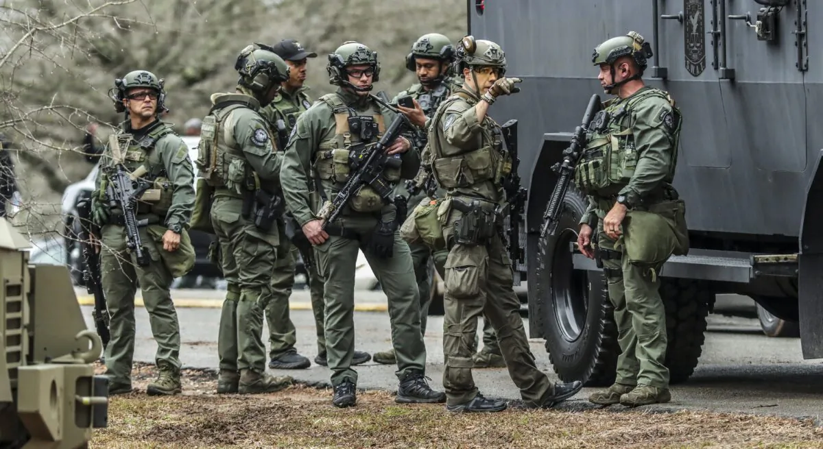DeKalb, Ga., and Atlanta SWAT members are pictured leaving the Gresham Park command post in Atlanta on Jan. 18, 2023. (John Spink/Atlanta Journal-Constitution via AP)
