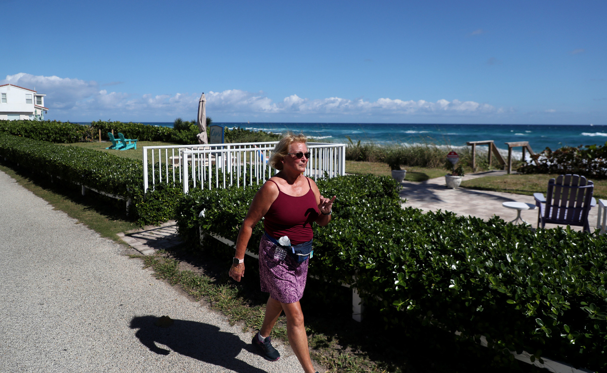 Pat Minishak of Boynton Beach, Florida, takes her daily walk along Old Ocean Blvd in Ocean Ridge.