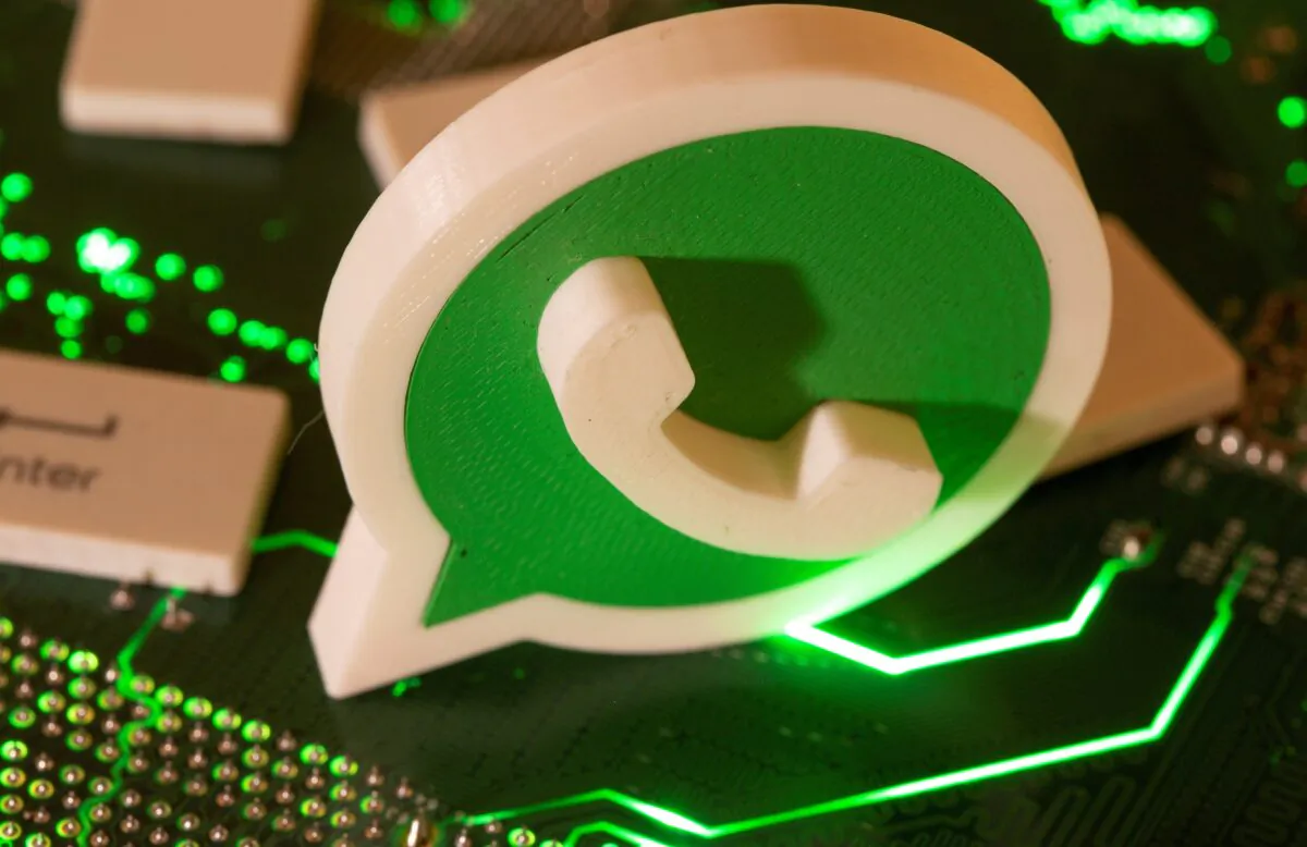 A 3D printed Whatsapp logo and keyboard buttons on a computer motherboard in an illustration taken on Jan. 21, 2021. (Dado Ruvic/Illustration/Reuters)