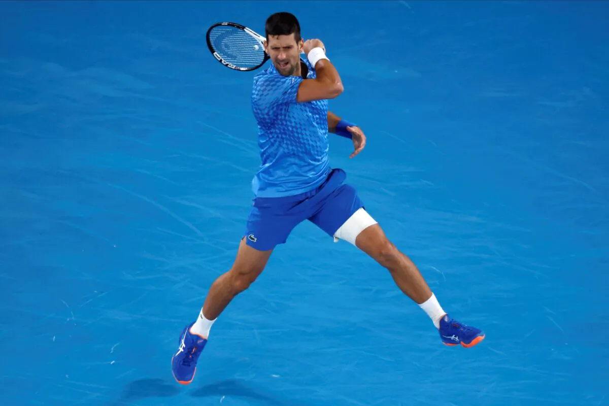 Novak Djokovic of Serbia plays a forehand return to Enzo Couacaud of France during their second-round match at the Australian Open tennis championship in Melbourne, Australia, on Jan. 19, 2023. (Asanka Brendon Ratnayake/AP Photo)