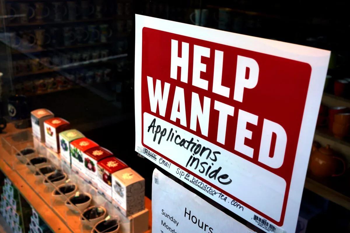 A help-wanted sign hangs in the front window of the Bar Harbor Tea Room, in Bar Harbor, Maine on June 11, 2022. (Robert F. Bukaty/AP Photo)