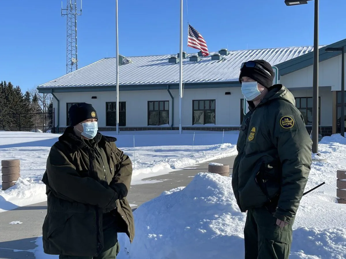 U.S. Border Patrol agents Katy Siemer, left and David Marcus stand outside the Customs and Border Protection facility in Pembina, N.D., on Jan. 25, 2022. (The Canadian Press/James McCarten)