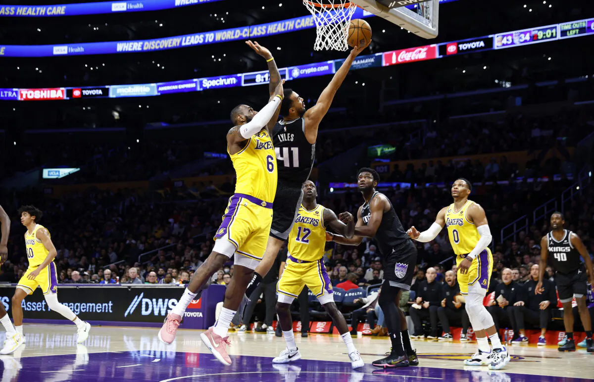 Trey Lyles (41) of the Sacramento Kings takes a shot against LeBron James (6) of the Los Angeles Lakers in the first in Los Angeles on Jan. 18, 2023. (Ronald Martinez/Getty Images)