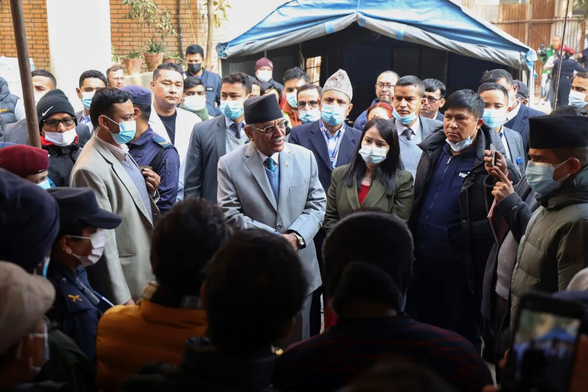 In this handout photo, Nepal Prime minister Pushpa Kamal Dahal Prachanda (C)  speaks to the officials during his visit to Teaching Hospital in Kathmandu, Nepal, on Jan. 19, 2023. (Nepal Prime Minister Secretariat via AP)