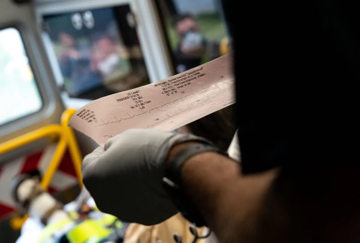 A doctor reads an EKG in Glen Burnie, Md., on Oct. 28, 2020. (Alex Edelman/AFP via Getty Images)