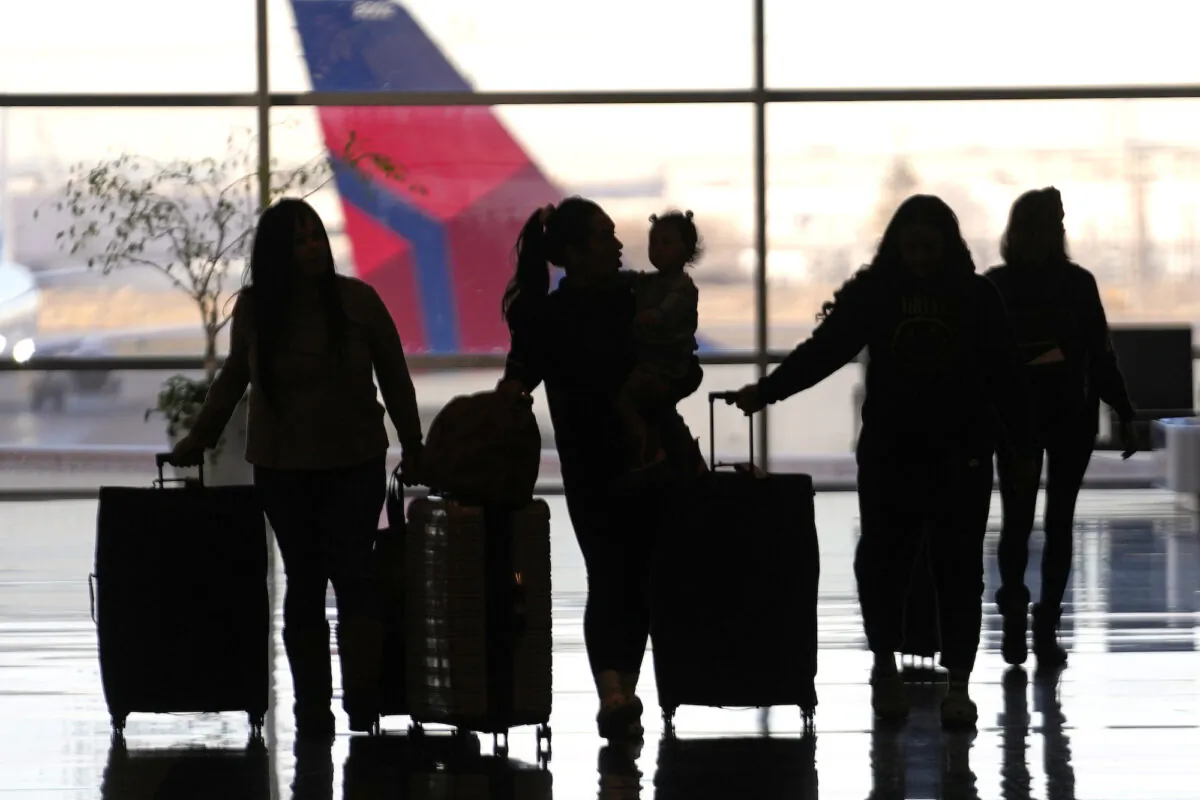 People pass through Salt Lake City International Airport, in Salt Lake City, Utah, on Jan. 11, 2023. (Rick Bowmer/AP Photo)