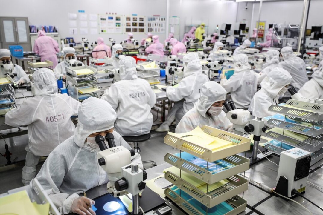 Workers producing LED chips at a factory in Huaian, in China's eastern Jiangsu Province, on June 16, 2020. (STR/AFP via Getty Images)