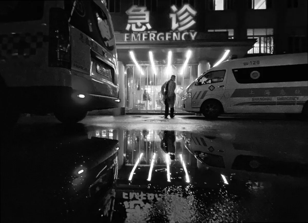 An ambulance driver walks into the busy emergency area of a hospital in Shanghai, China, on Jan. 13, 2023. (Kevin Frayer/Getty Images)