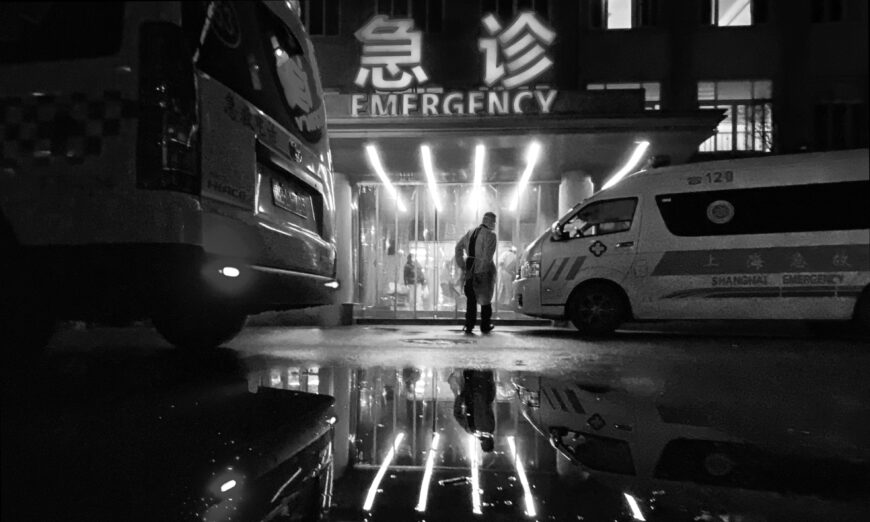 An ambulance driver walks into the busy emergency area of a hospital on January 13, 2023, in Shanghai, China. (Kevin Frayer/Getty Images)