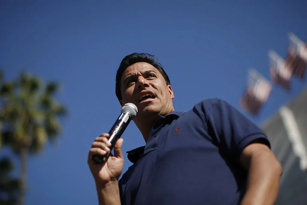 Then Los Angeles Councilman José Huizar speaks on the steps of City Hall during the "Forward on Climate" rally to call on President Obama to take strong action on the climate crisis in Los Angeles, on Feb. 17, 2013. (David McNew/Getty Images)