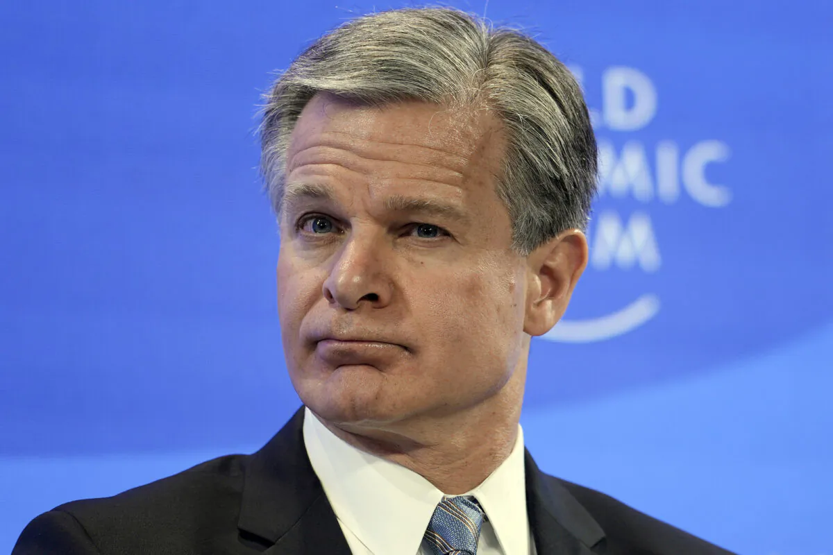 FBI Director Christopher Wray listens at the World Economic Forum in Davos, Switzerland, on Jan. 19, 2023. (Markus Schreiber/AP Photo)