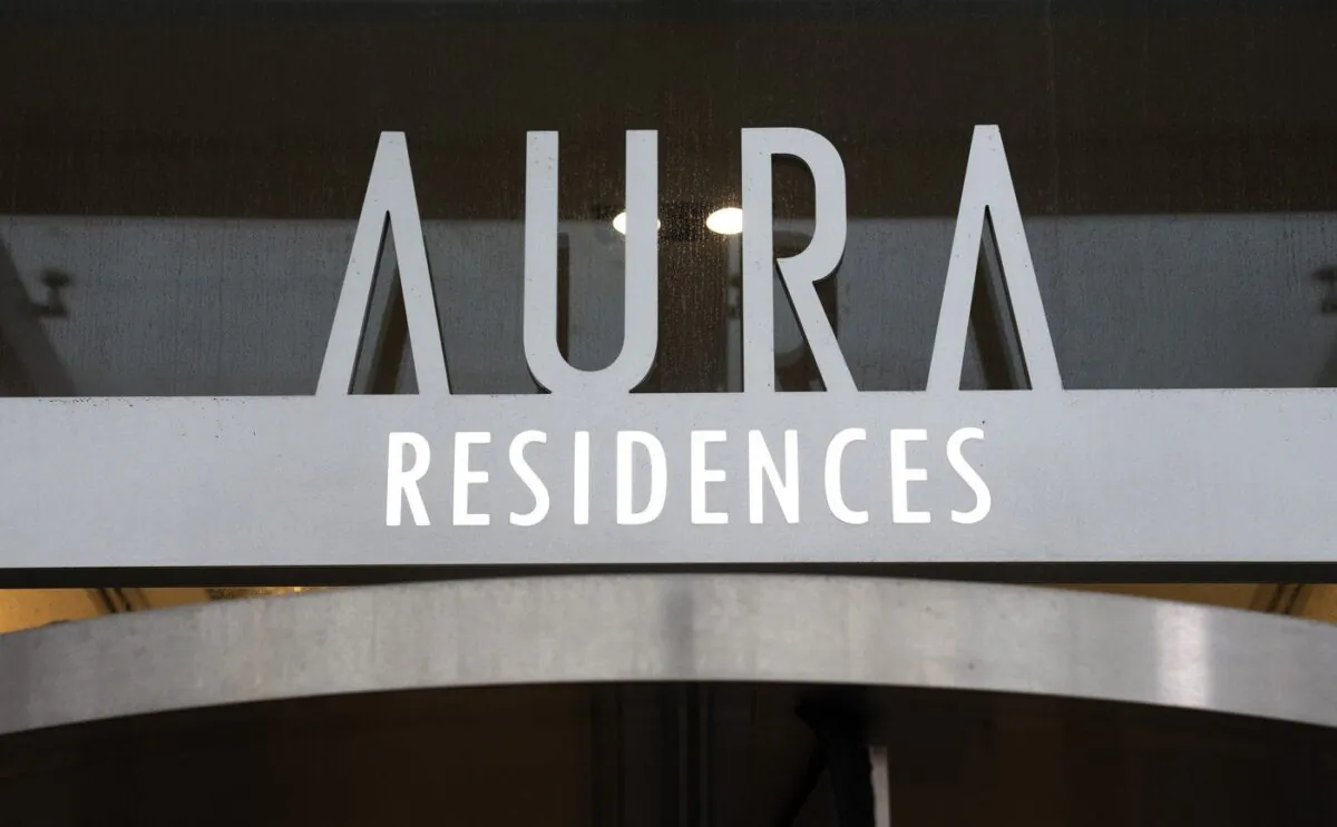 The sign on the Aura condominium building is shown in Toronto on Jan. 17, 2023. (The Canadian Press/Frank Gunn)