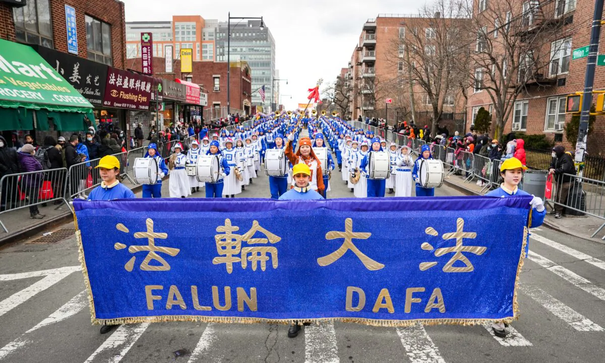 Falun Gong practitioners take part in the Chinese New Year Parade in Flushing, N.Y., on Jan. 21, 2023. (Samira Bouaou/The Epoch Times)