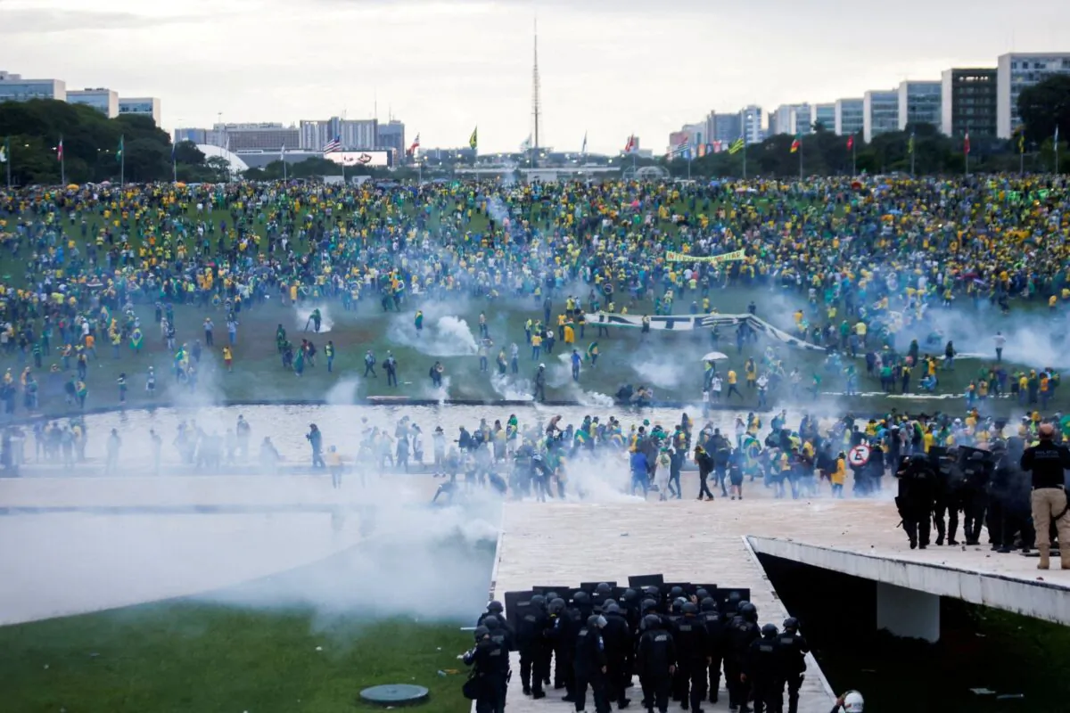 Supporters of Brazil's former President Jair Bolsonaro demonstrate against President Luiz Inacio Lula da Silva as security forces operate, outside Brazil’s National Congress in Brasilia, Brazil, on Jan. 8, 2023. (Adriano Machado/Reuters)