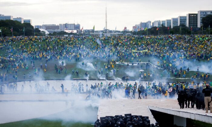 Supporters of Brazil's former President Jair Bolsonaro demonstrate against President Luiz Inacio Lula da Silva as security forces operate, outside Brazil’s National Congress in Brasilia, Brazil, on Jan. 8, 2023. (Adriano Machado/Reuters)