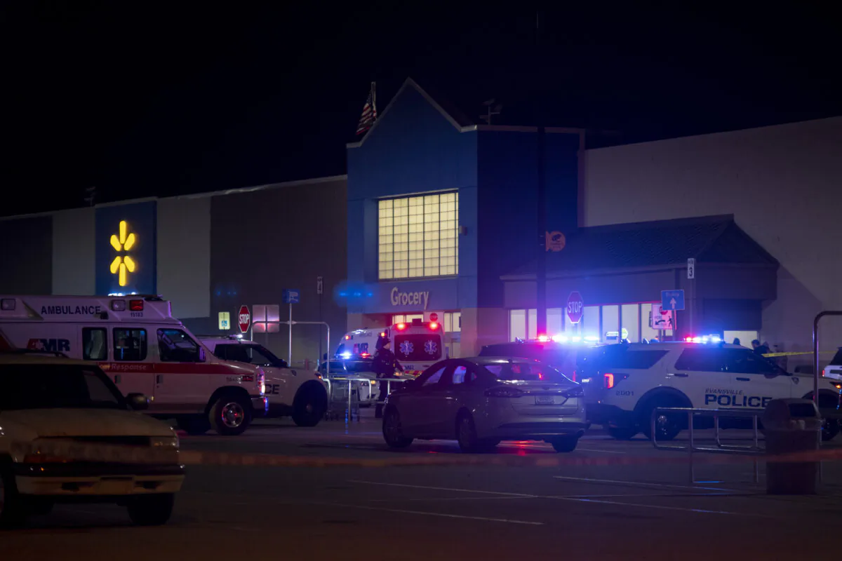Emergency responders work the scene of a shooting at the West Side Walmart in Evansville, Ind., on Jan. 19, 2023. (MaCabe Brown/Evansville Courier & Press via AP)
