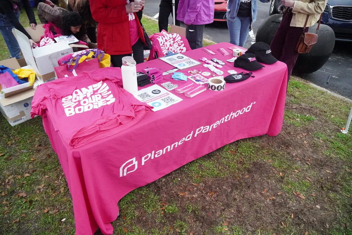 A Planned Parenthood table outside The Moon, a bar where Kamala Harris spoke on abortion in Tallahassee, Fla., on Jan. 22, 2023. (Jackson Elliott/The Epoch Times)