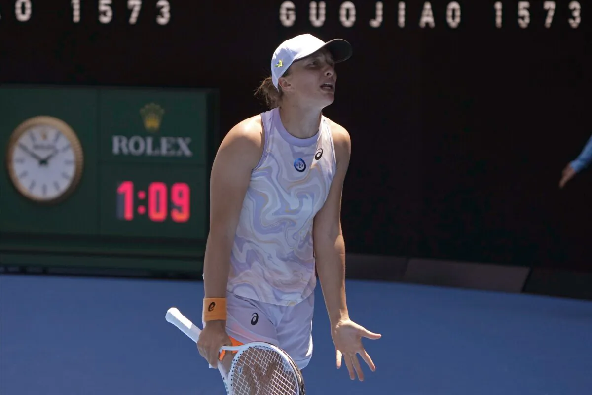 Iga Swiatek of Poland reacts as she plays against Elena Rybakina of Kazakhstan during their fourth round match at the Australian Open tennis championship in Melbourne, Australia, on Jan. 22, 2023. (Mark Baker/AP Photo)