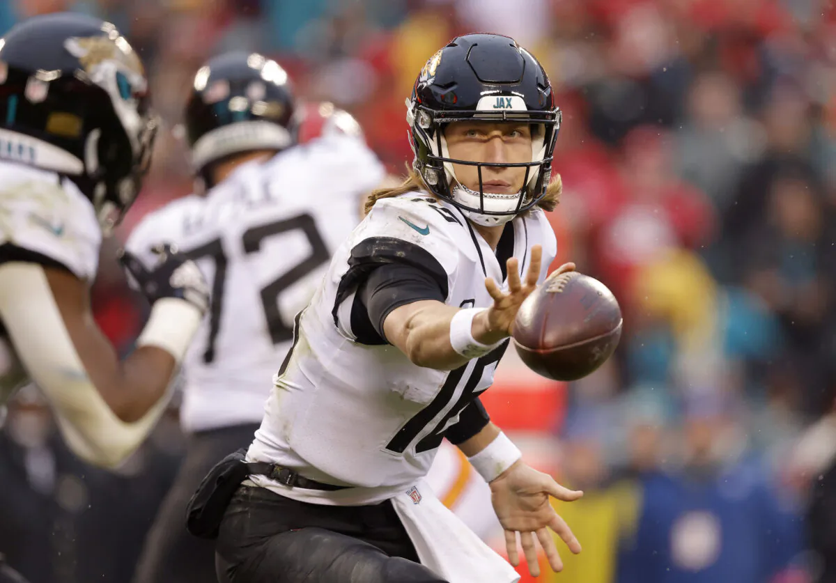 Trevor Lawrence (16) of the Jacksonville Jaguars flicks the ball against the Kansas City Chiefs during the second quarter in the AFC Divisional Playoff game at Arrowhead Stadium in Kansas City, Mo., on Jan. 21, 2023. (David Eulitt/Getty Images)