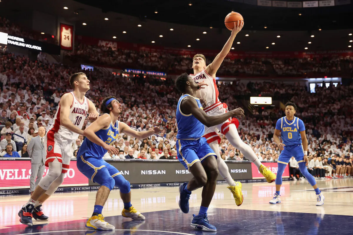 Pelle Larsson (3) of the Arizona Wildcats attempts a shot over Adem Bona (3) of the UCLA Bruins during the first half of the NCAA game at McKale Center in Tucson, Ariz., on Jan. 21, 2023. (Christian Petersen/Getty Images)