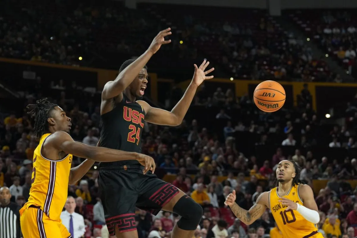 Arizona State Sun Devils forward Jamiya Neal (5) fouls USC Trojans forward Joshua Morgan (24) during the first half at Desert Financial Arena in Tempe, Ariz., on Jan. 21, 2023. (Joe Camporeale/USA TODAY Sports via Field Level Media)