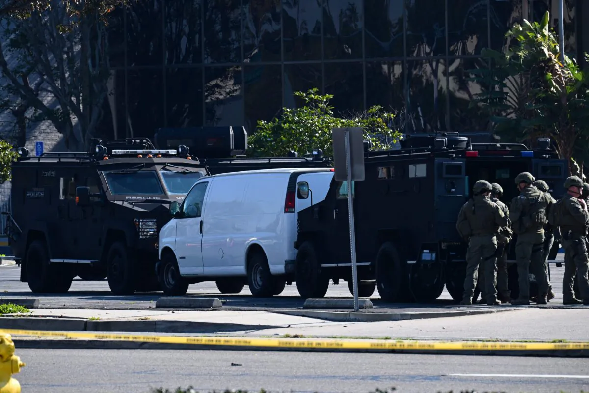 Law enforcement personnel outside the site in Torrance, Calif., where the alleged suspect in the mass shooting in which 10 people were killed in Monterey Park, California, is believed to be holed up on Jan. 22, 2023. (Robyn Beck/AFP via Getty Images)