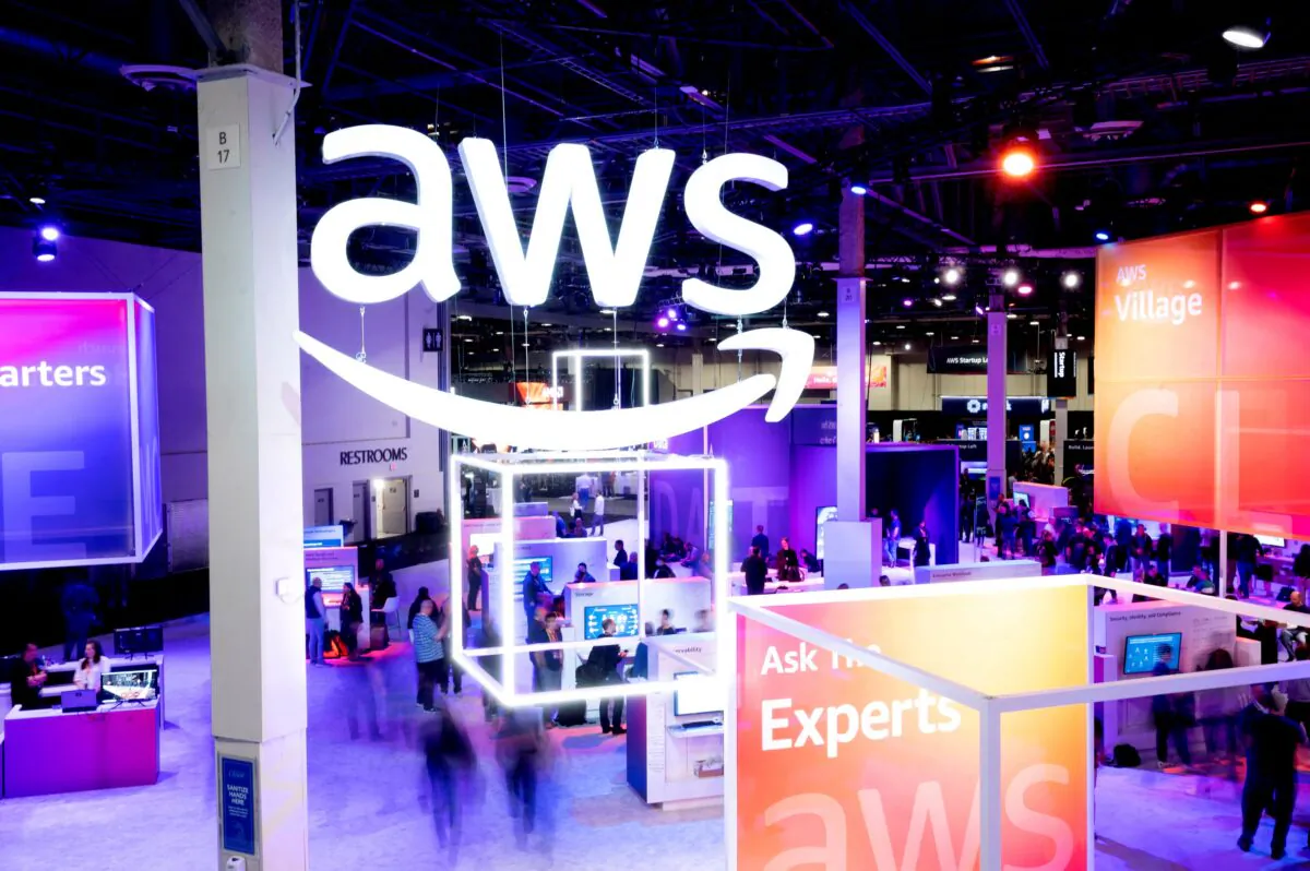 Attendees walk through an expo hall at AWS re:Invent 2022, a conference hosted by Amazon Web Services (AWS), in Las Vegas on Nov. 30, 2022. (Noah Berger/AWS/Handout via Reuters)