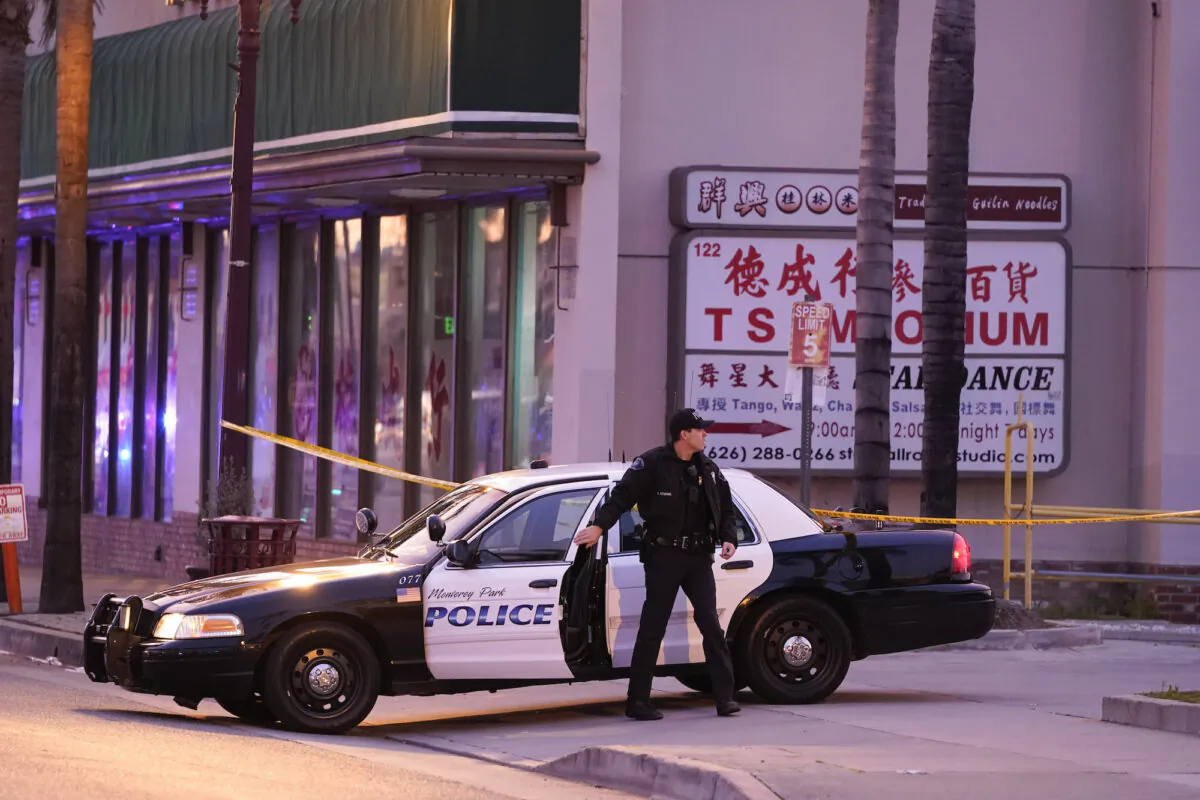 A police officer gets out of his vehicle near a ballroom dance club in Monterey Park, Calif., on Jan. 22, 2023. (Jae C. Hong/AP Photo)