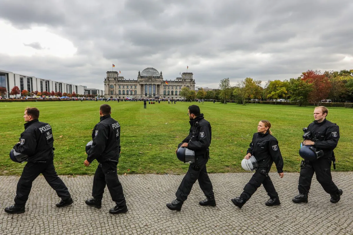 German riot police move in formation in front of the Reichstag where a demonstration organized by the right-wing Alternative for Germany (AfD) political party is taking place in Berlin on Oct. 8, 2022. (Omer Messinger/Getty Images)