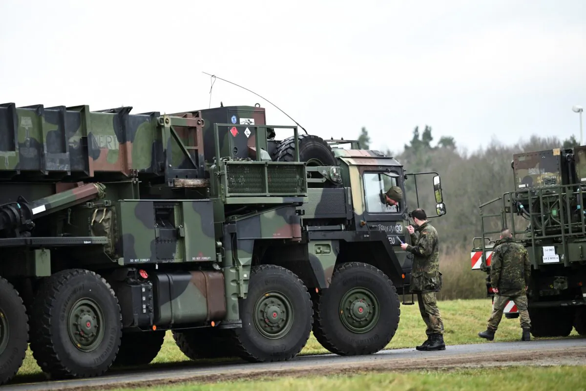 A German Air Force soldier prepares a vehicle before the convoy leaves as the mobile defence surface-to-air missile systems Patriots are transported to Poland from Gnoien, Germany, on Jan. 23, 2023. (Annegret Hilse/Reuters)