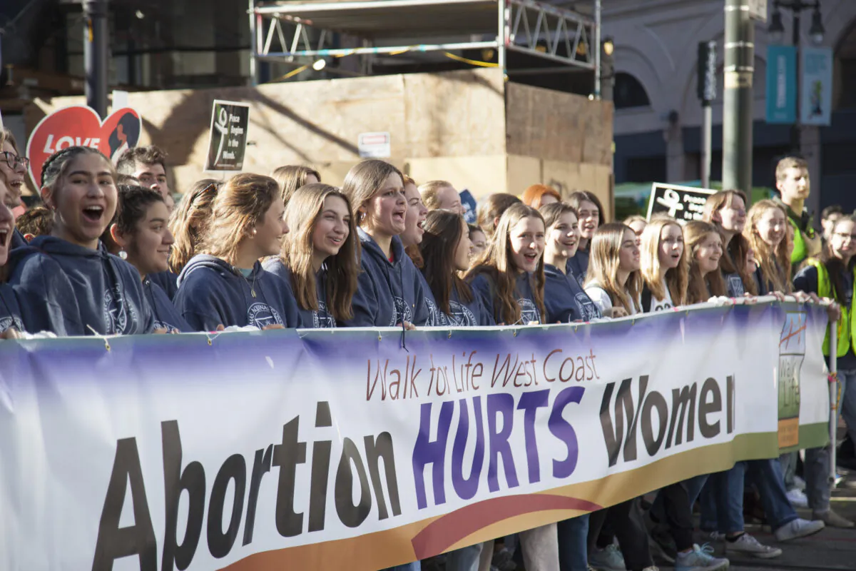 Walk for Life West Coast attendees walk through San Francisco during an annual pro-life march on Jan. 21, 2023. (Lear Zhou/The Epoch Times)
