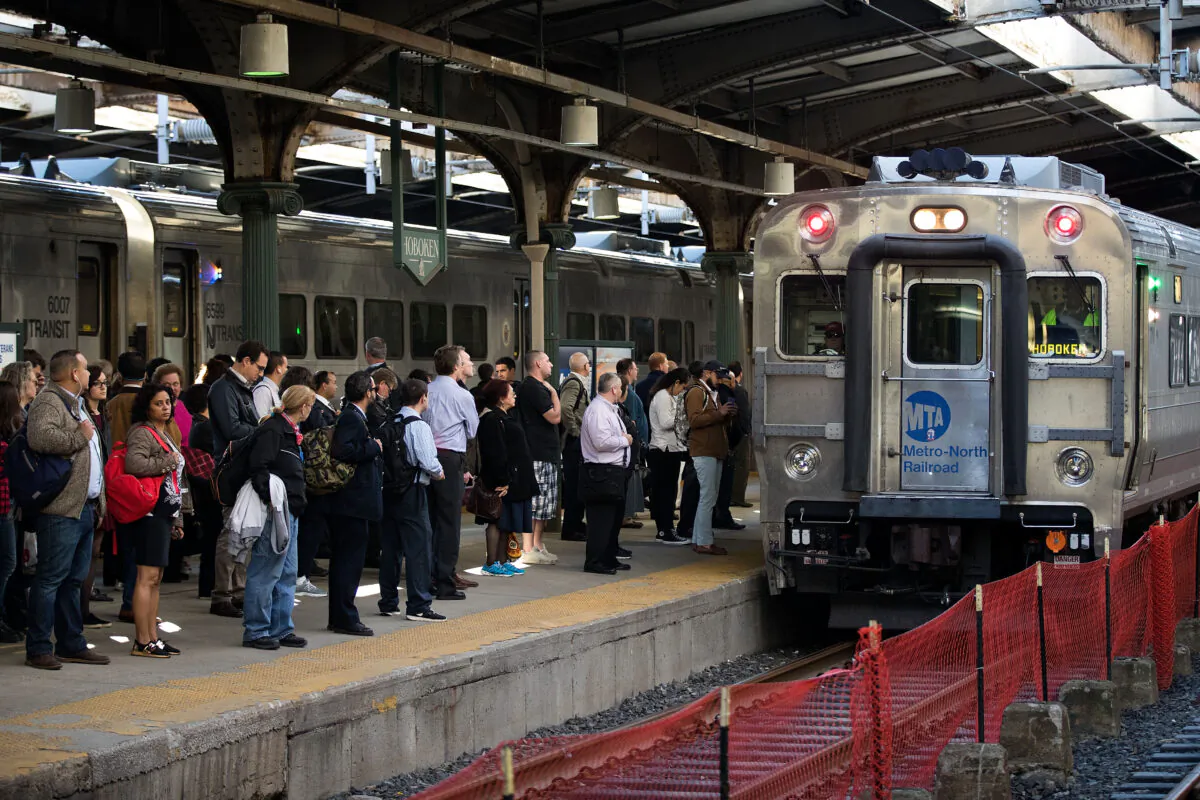 Passengers wait on the platform as a train pulls into Hoboken Terminal during afternoon rush hour in Hoboken, N.J., on Oct. 10, 2016. (Drew Angerer/Getty Images)