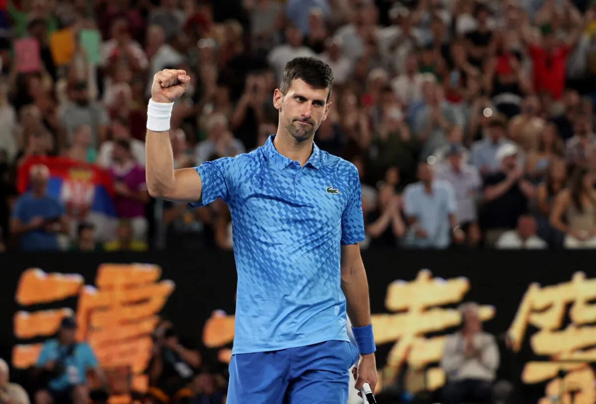Serbia's Novak Djokovic celebrates winning his fourth round match against Australia's Alex De Minaur during Australian Open in Melbourne Park, Melbourne, Australia, on Jan. 23, 2023. (Loren Elliott/Reuters)
