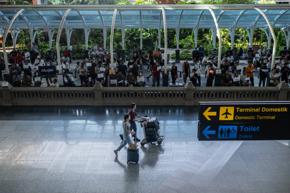 Foreign tourists arrive at the International arrival of Ngurah Rai airport in Bali, Indonesia, on Dec. 7, 2022. (Agung Parameswara/Getty Images)